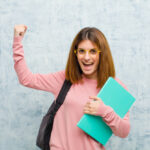 young student woman shouting triumphantly looking like excited happy surprised winner celebrating against grunge wall background 1194 32325 150x150 - نحوه نوشتن بیان مسئله پروپوزال